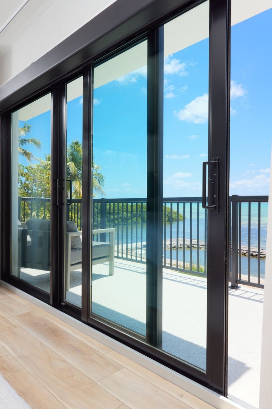 Architectural photography of luxury hotel suites at Pine and Palms Key Largo focusing on premium door and window installations.