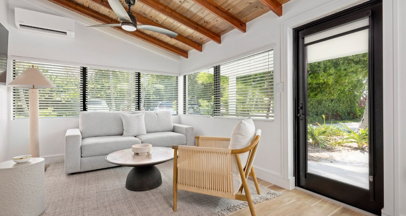 Architectural photography of luxury hotel suites at Pine and Palms Key Largo focusing on premium door and window installations.