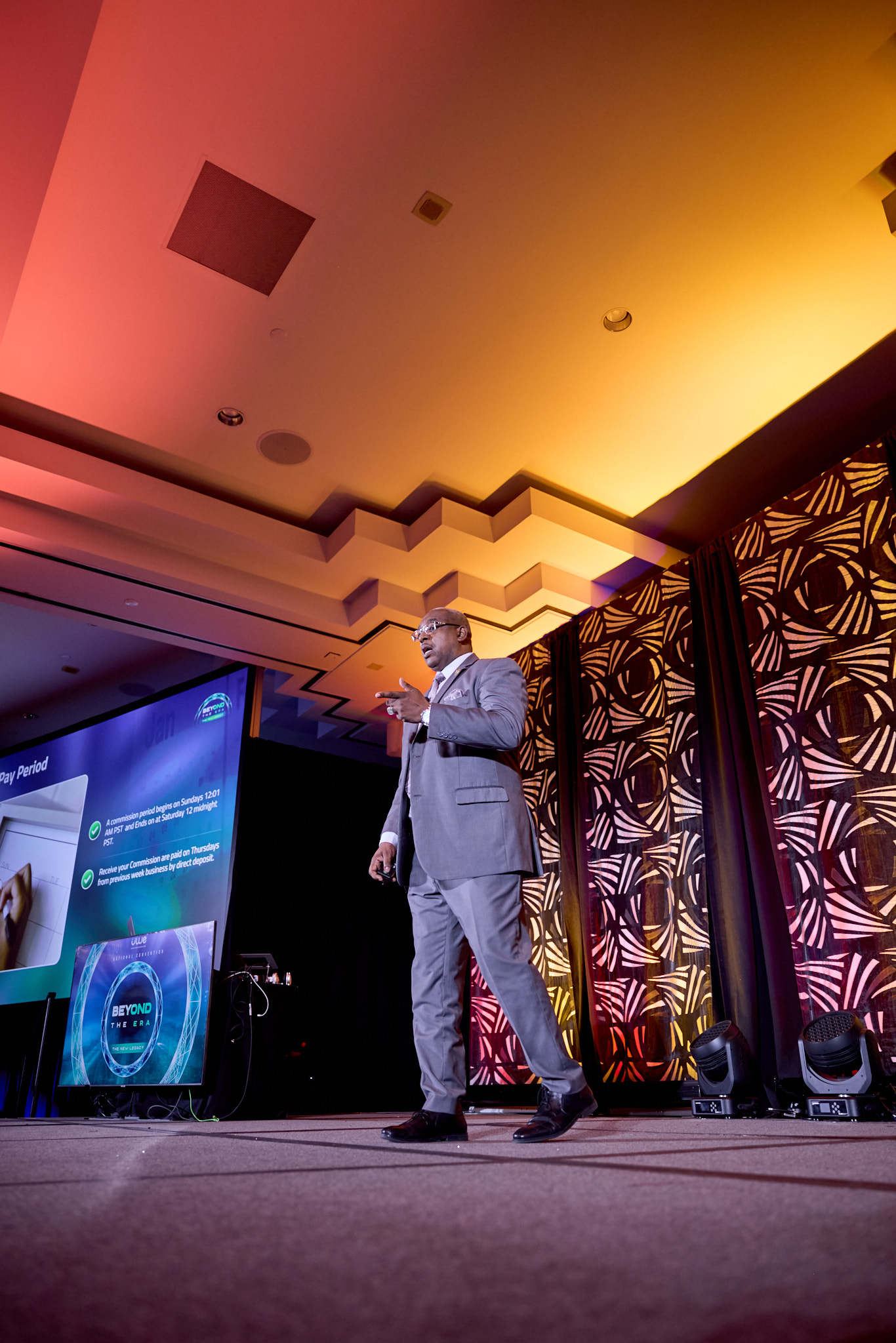 Event photography of speakers and networking at the UWE National Convention in Atlanta Georgia featuring high-energy corporate branding.