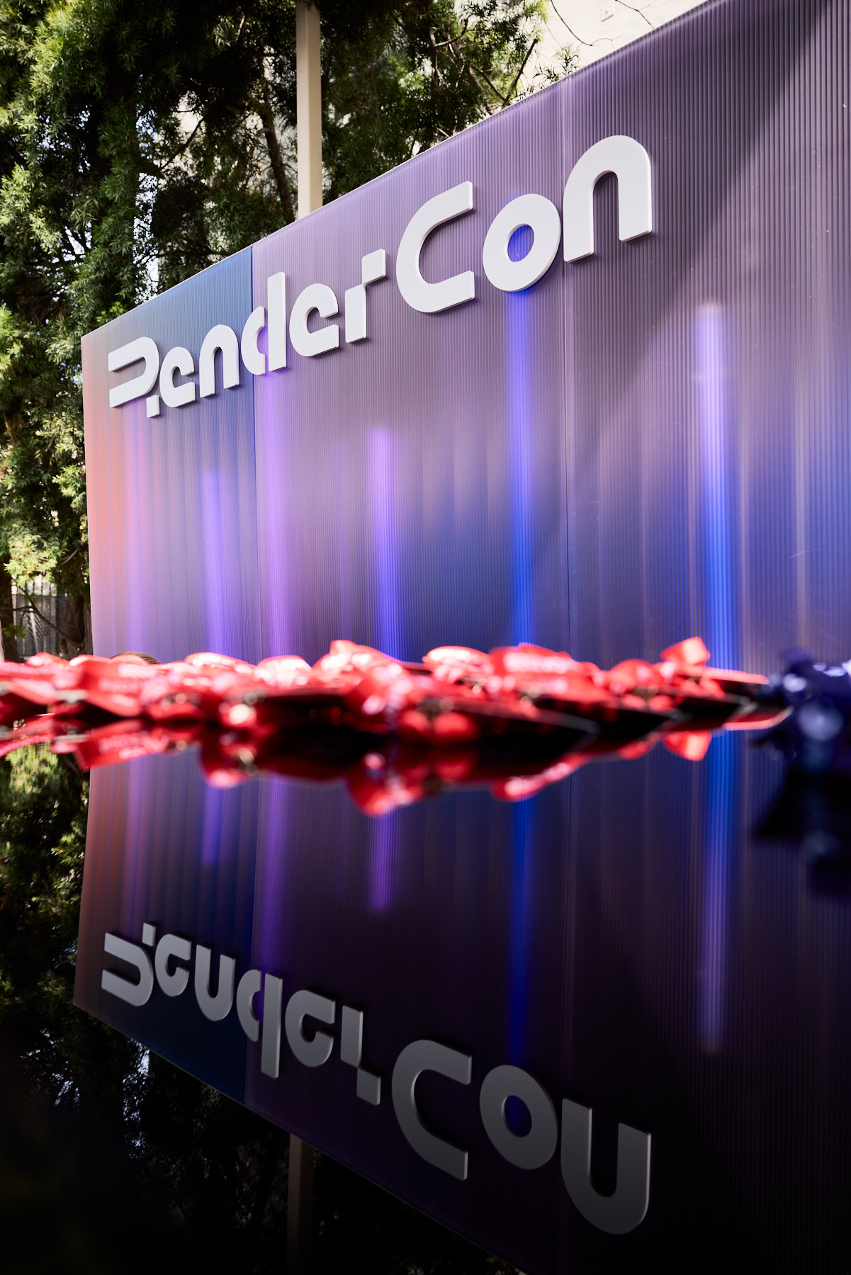 Cinematic branding and audiovisual technology displays at RenderCon Los Angeles, documented with high-speed digital tech workflow.