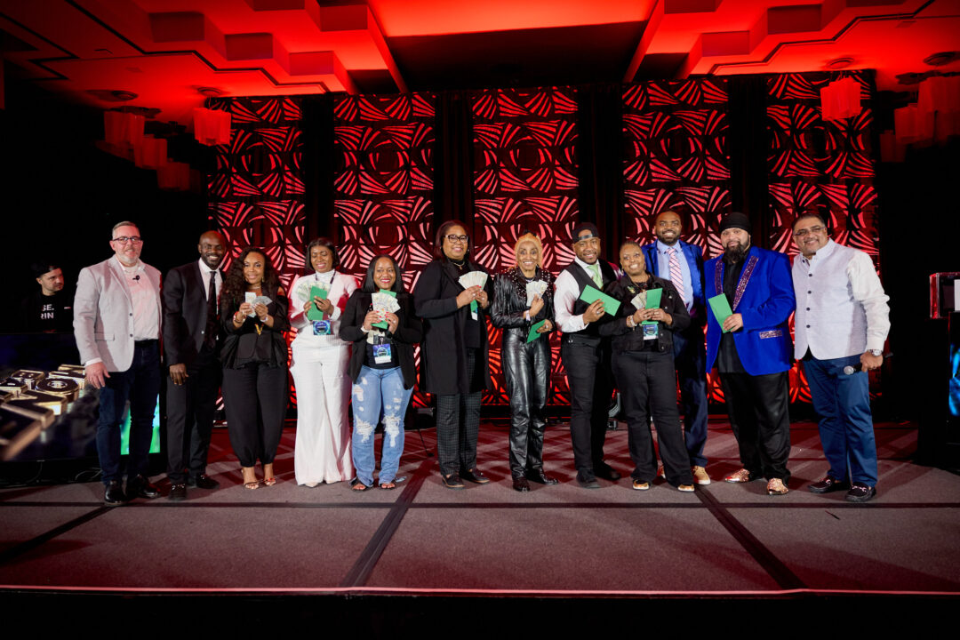Event photography of speakers and networking at the UWE National Convention in Atlanta Georgia featuring high-energy corporate branding.