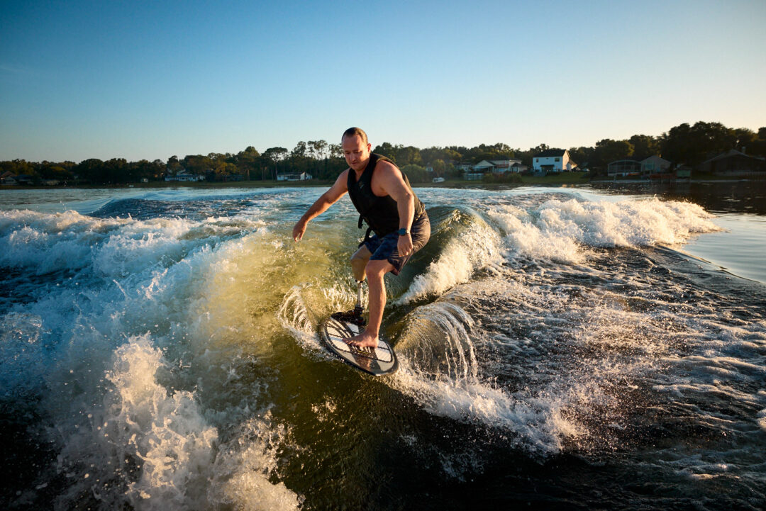 Action and documentary visual production for the Wake for Warriors (W4W) foundation. Capturing wounded veterans and their families experiencing therapeutic water sports, wakeboarding, and wake surfing as pathways to emotional and physical healing. Shot by Luis Cano. High-speed action sports photography of wounded veterans wake surfing at a Wake for Warriors therapeutic event, shot by Luis Cano.
