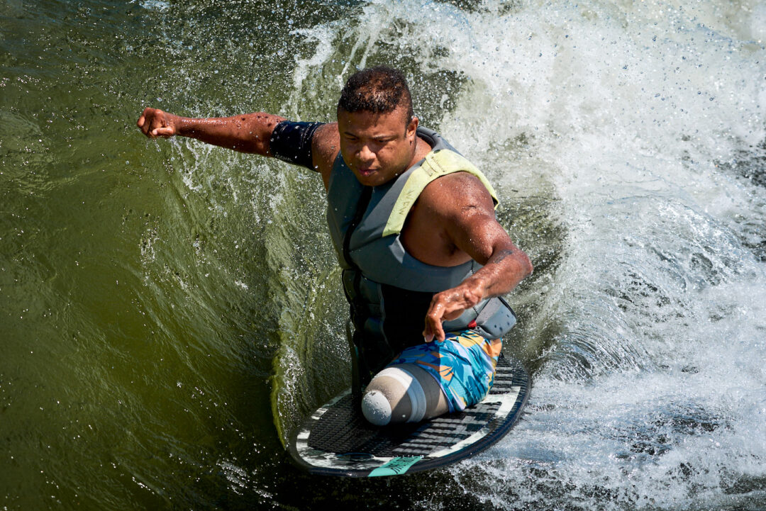Action and documentary visual production for the Wake for Warriors (W4W) foundation. Capturing wounded veterans and their families experiencing therapeutic water sports, wakeboarding, and wake surfing as pathways to emotional and physical healing. Shot by Luis Cano. High-speed action sports photography of wounded veterans wake surfing at a Wake for Warriors therapeutic event, shot by Luis Cano.