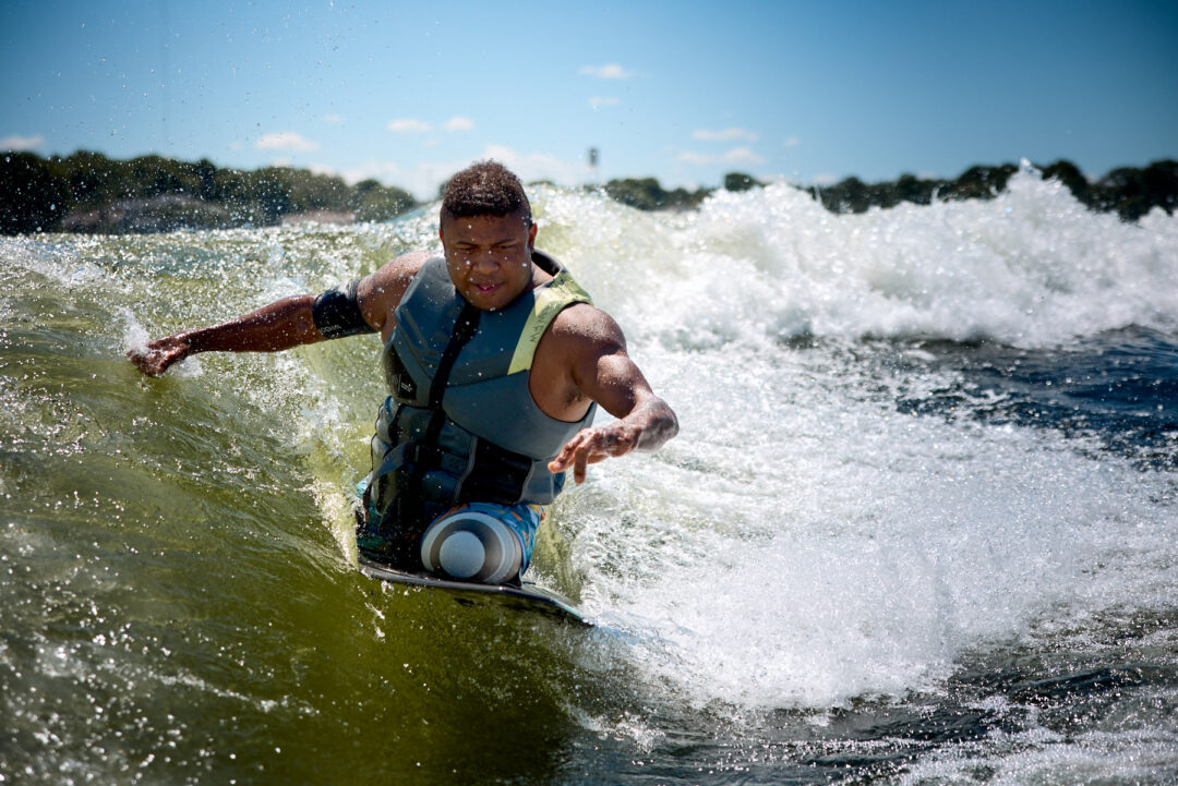 Action and documentary visual production for the Wake for Warriors (W4W) foundation. Capturing wounded veterans and their families experiencing therapeutic water sports, wakeboarding, and wake surfing as pathways to emotional and physical healing. Shot by Luis Cano. High-speed action sports photography of wounded veterans wake surfing at a Wake for Warriors therapeutic event, shot by Luis Cano.