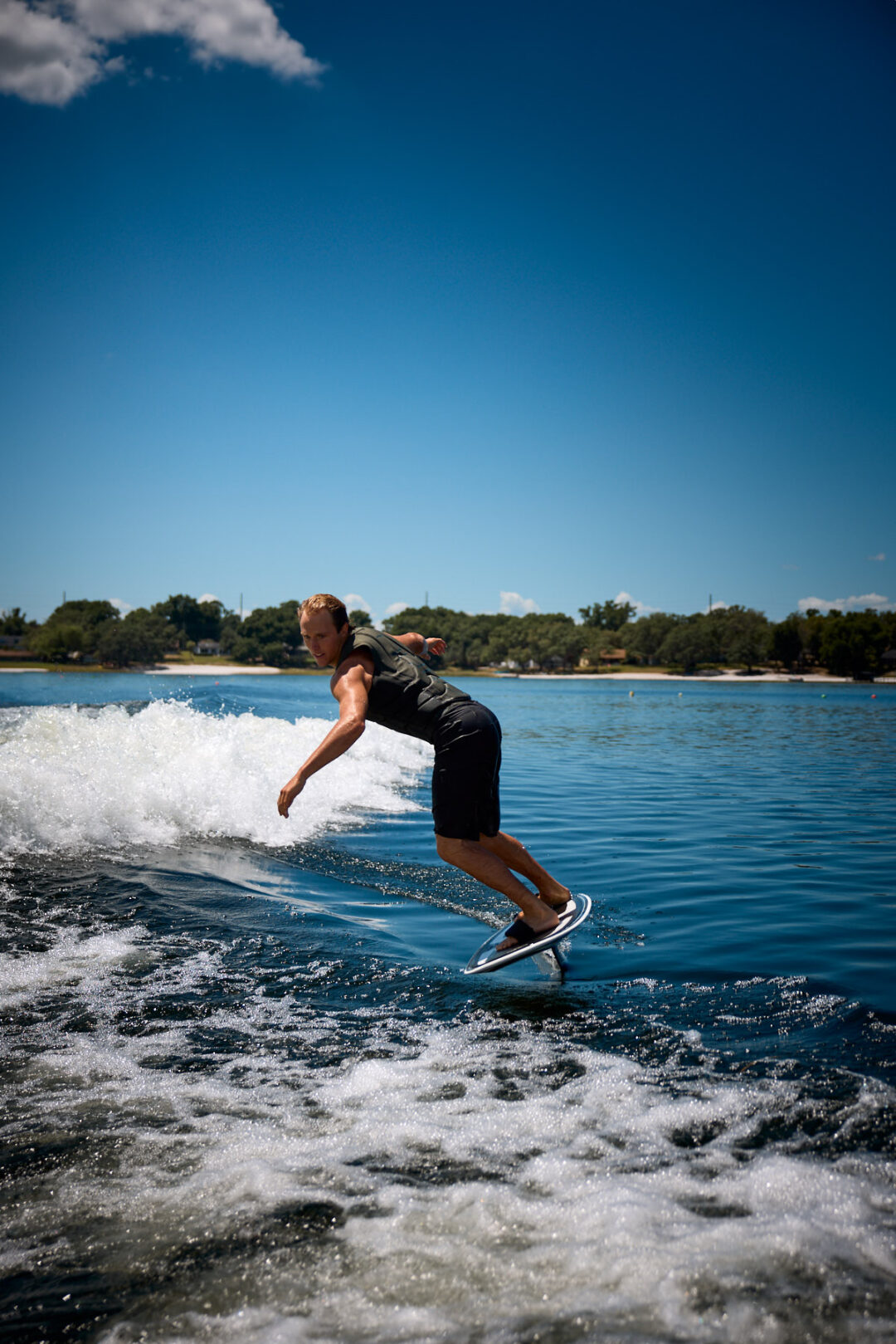 Action and documentary visual production for the Wake for Warriors (W4W) foundation. Capturing wounded veterans and their families experiencing therapeutic water sports, wakeboarding, and wake surfing as pathways to emotional and physical healing. Shot by Luis Cano. High-speed action sports photography of wounded veterans wake surfing at a Wake for Warriors therapeutic event, shot by Luis Cano.