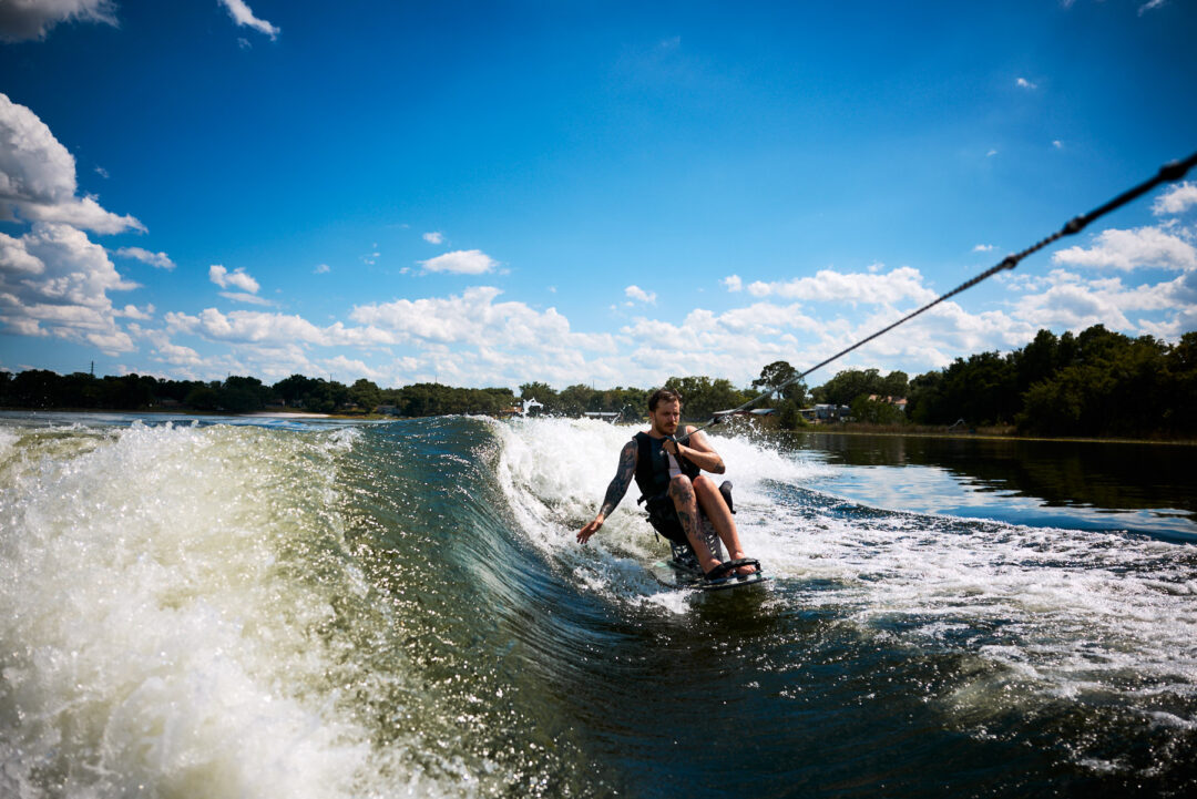 Action and documentary visual production for the Wake for Warriors (W4W) foundation. Capturing wounded veterans and their families experiencing therapeutic water sports, wakeboarding, and wake surfing as pathways to emotional and physical healing. Shot by Luis Cano. High-speed action sports photography of wounded veterans wake surfing at a Wake for Warriors therapeutic event, shot by Luis Cano.
