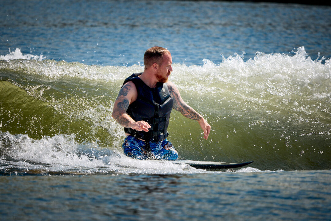 Action and documentary visual production for the Wake for Warriors (W4W) foundation. Capturing wounded veterans and their families experiencing therapeutic water sports, wakeboarding, and wake surfing as pathways to emotional and physical healing. Shot by Luis Cano. High-speed action sports photography of wounded veterans wake surfing at a Wake for Warriors therapeutic event, shot by Luis Cano.