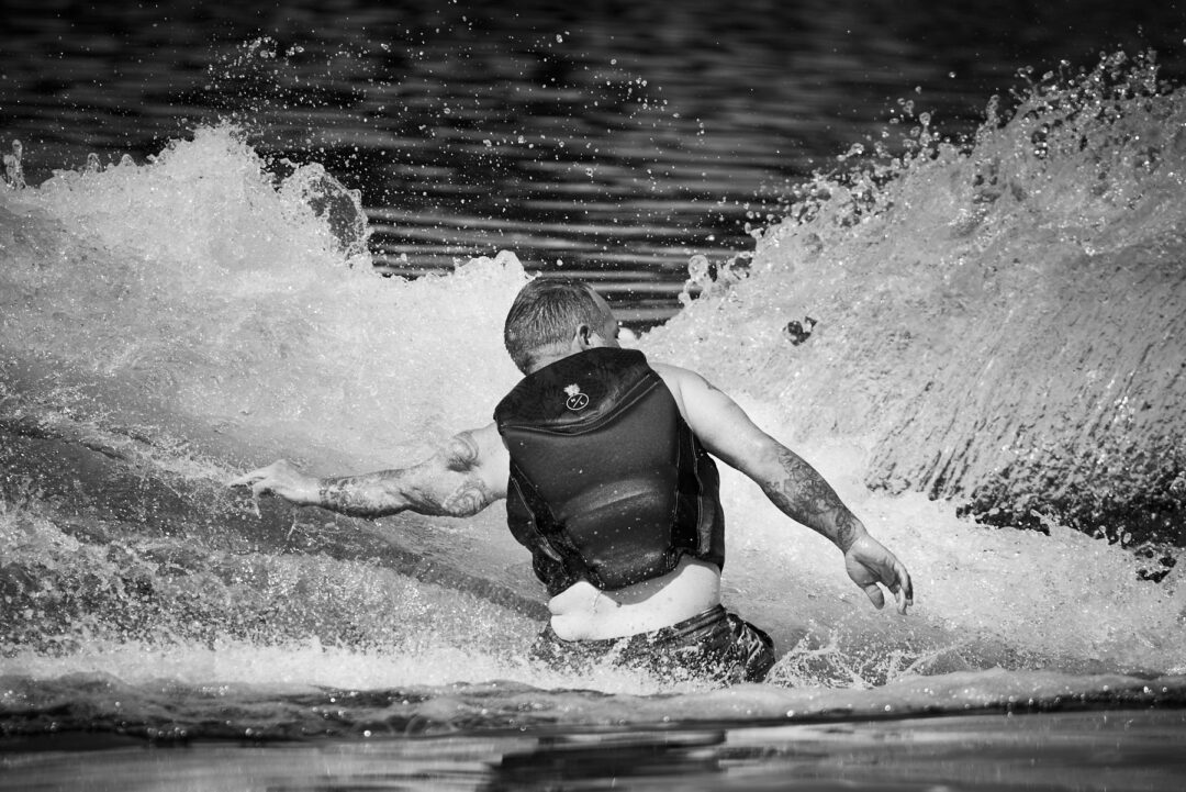 Action and documentary visual production for the Wake for Warriors (W4W) foundation. Capturing wounded veterans and their families experiencing therapeutic water sports, wakeboarding, and wake surfing as pathways to emotional and physical healing. Shot by Luis Cano. High-speed action sports photography of wounded veterans wake surfing at a Wake for Warriors therapeutic event, shot by Luis Cano.