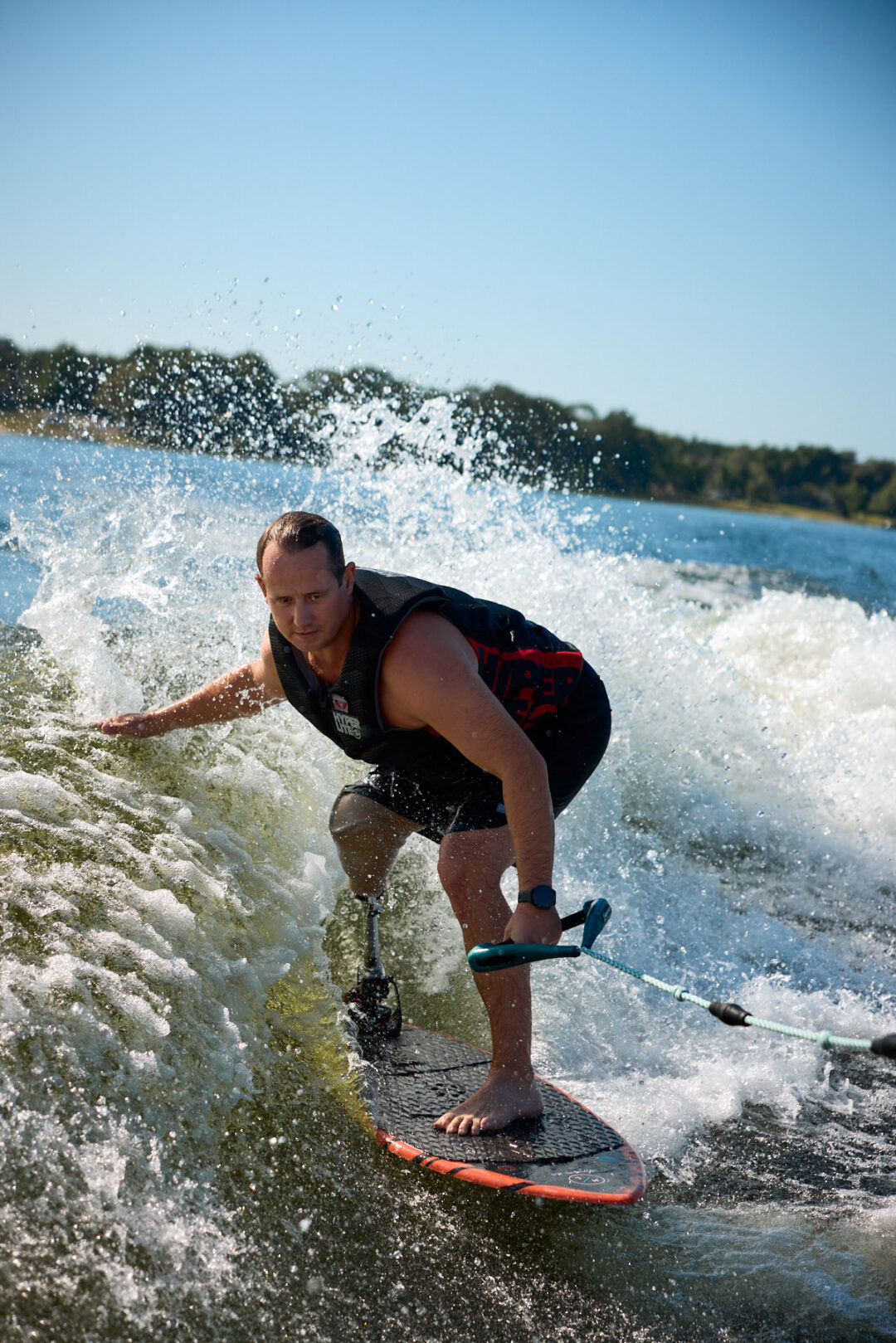 Action and documentary visual production for the Wake for Warriors (W4W) foundation. Capturing wounded veterans and their families experiencing therapeutic water sports, wakeboarding, and wake surfing as pathways to emotional and physical healing. Shot by Luis Cano. High-speed action sports photography of wounded veterans wake surfing at a Wake for Warriors therapeutic event, shot by Luis Cano.