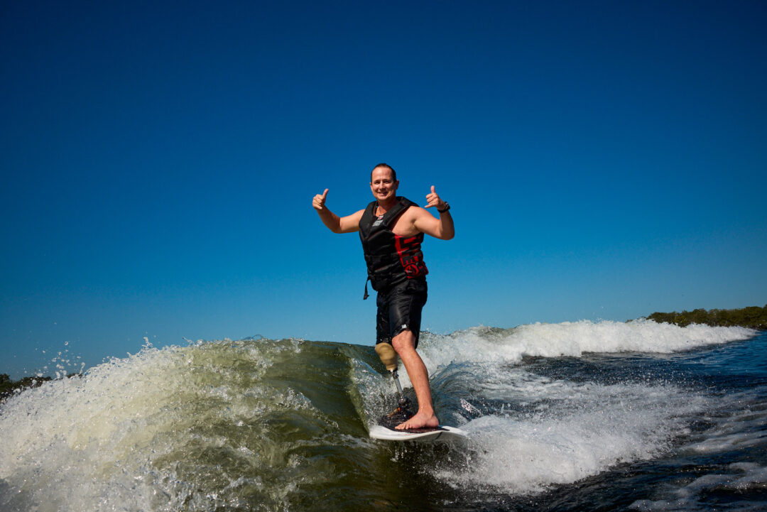 Action and documentary visual production for the Wake for Warriors (W4W) foundation. Capturing wounded veterans and their families experiencing therapeutic water sports, wakeboarding, and wake surfing as pathways to emotional and physical healing. Shot by Luis Cano. High-speed action sports photography of wounded veterans wake surfing at a Wake for Warriors therapeutic event, shot by Luis Cano.