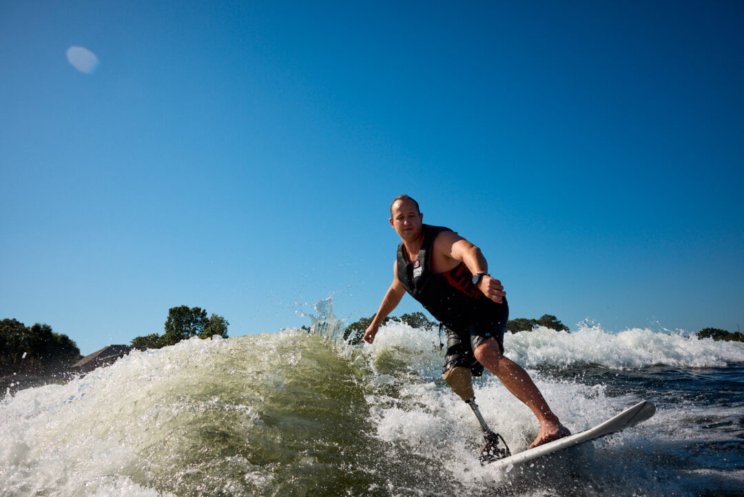 Action and documentary visual production for the Wake for Warriors (W4W) foundation. Capturing wounded veterans and their families experiencing therapeutic water sports, wakeboarding, and wake surfing as pathways to emotional and physical healing. Shot by Luis Cano. High-speed action sports photography of wounded veterans wake surfing at a Wake for Warriors therapeutic event, shot by Luis Cano.