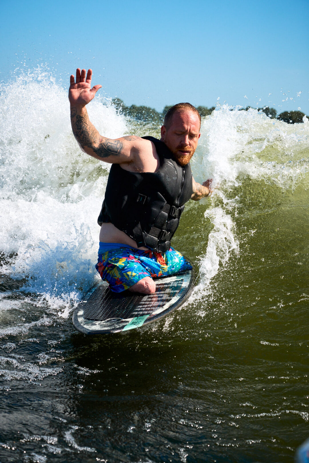 Action and documentary visual production for the Wake for Warriors (W4W) foundation. Capturing wounded veterans and their families experiencing therapeutic water sports, wakeboarding, and wake surfing as pathways to emotional and physical healing. Shot by Luis Cano. High-speed action sports photography of wounded veterans wake surfing at a Wake for Warriors therapeutic event, shot by Luis Cano.