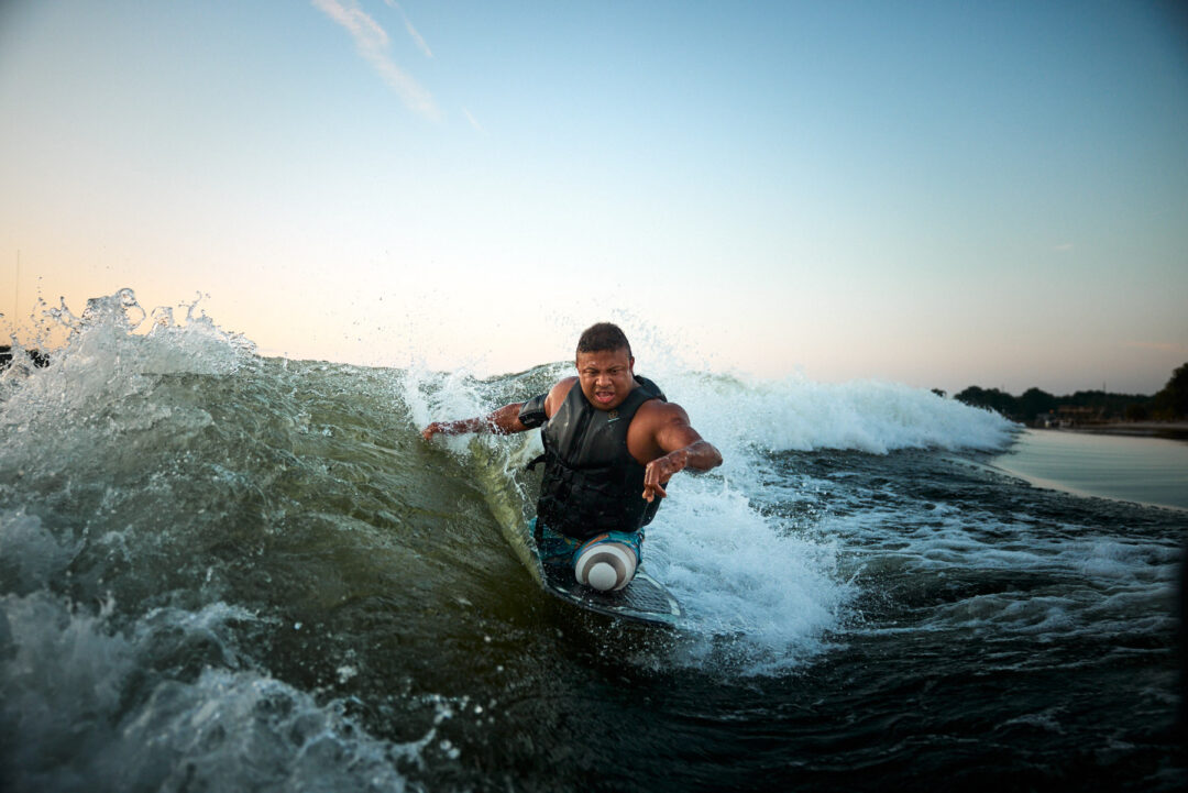 Action and documentary visual production for the Wake for Warriors (W4W) foundation. Capturing wounded veterans and their families experiencing therapeutic water sports, wakeboarding, and wake surfing as pathways to emotional and physical healing. Shot by Luis Cano. High-speed action sports photography of wounded veterans wake surfing at a Wake for Warriors therapeutic event, shot by Luis Cano.