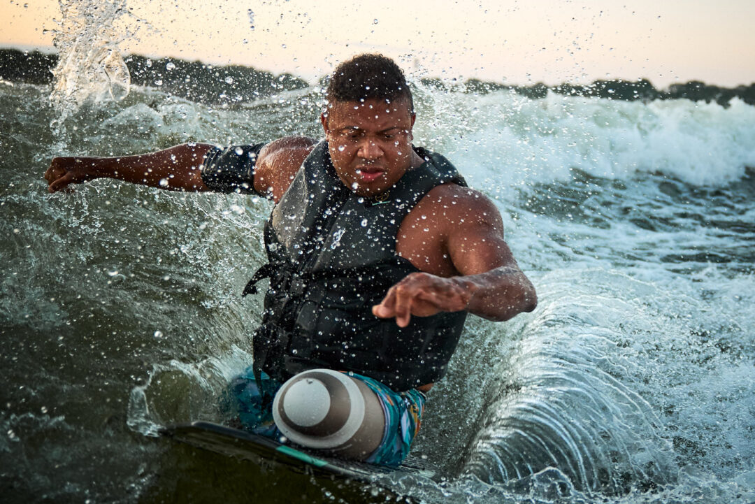 Action and documentary visual production for the Wake for Warriors (W4W) foundation. Capturing wounded veterans and their families experiencing therapeutic water sports, wakeboarding, and wake surfing as pathways to emotional and physical healing. Shot by Luis Cano. High-speed action sports photography of wounded veterans wake surfing at a Wake for Warriors therapeutic event, shot by Luis Cano.